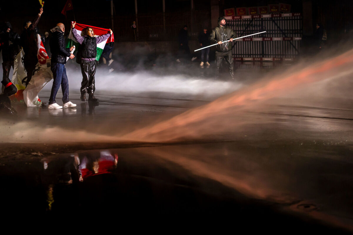 Protesters clash with riot police using water cannons and tear gas after a rally against the World Economic Forum and the visit of U.S. President Donald Trump to Switzerland, on Monday, Jan. 19, 2026 in Zurich, Switzerland. (Michael Buholzer/Keystone via AP)