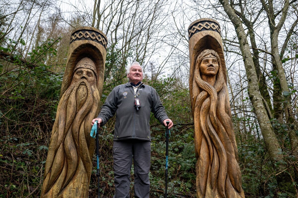 Mike Moroney pauses beside a wooden sculpture of Diarmuid and Aoife. Picture Chani Anderson