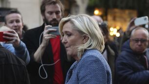 <p>French far-right leader Marine Le Pen leaves the National Rally headquarters after a French court convicted Marine Le Pen of embezzlement and barred her from seeking public office for five years, Monday, March 31, 2025 in Paris. (AP Photo/Thomas Padilla)</p>