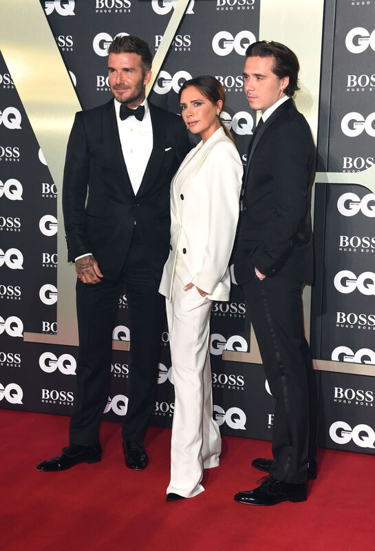 David Beckham (left), Victoria Beckham and Brooklyn Beckham in 2019. Picture: Matt Crossick/PA Wire