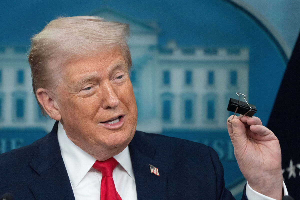 President Donald Trump holds a binder clip as he speaks during a press briefing at the White House in Washington, Tuesday, Jan. 20, 2026. Picture: AP Photo/Mark Schiefelbein