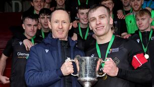 <p>DEFENCE: Raymond O'Malley, Chairperson Irish Universities Football Union, presents the Collingwood Cup to Dean O'Shea, Maynooth University. Pic: Jim Coughlan.</p>