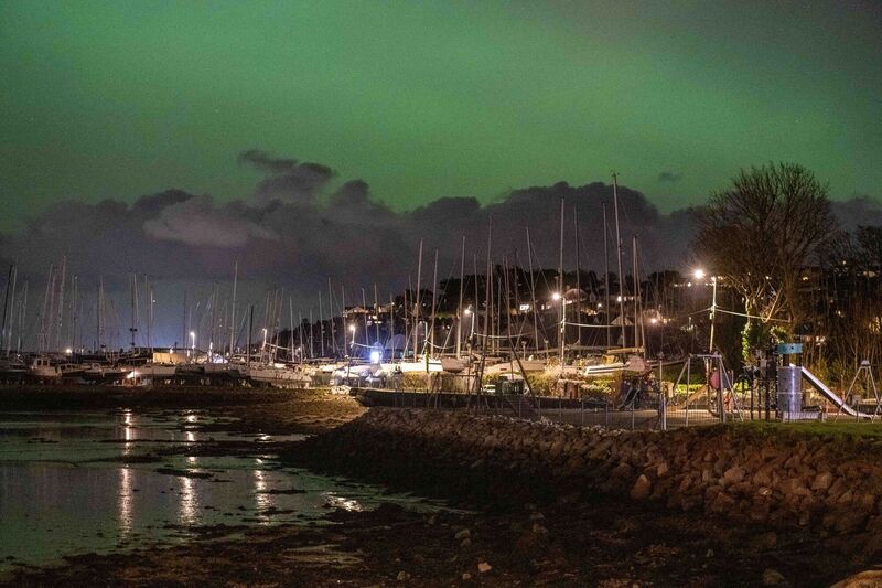 The Aurora Borealis occurs when charged particles from the sun collide with gases in Earth's upper atmosphere. 