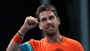 Cameron Norrie clenches his fist after beating Emilio Nava (Dar Yasin/AP)