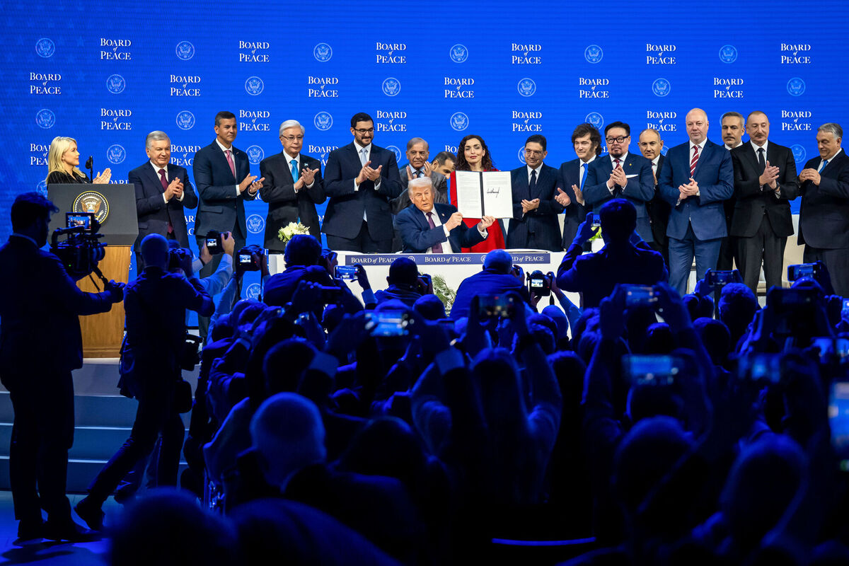President Donald Trump, center, holds up a signed Board of Peace charter during the Annual Meeting of the World Economic Forum in Davos, Switzerland, Thursday, Jan. 22, 2026. Picture: Gian Ehrenzeller/Keystone via AP