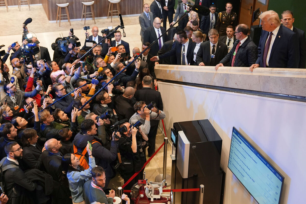 Journalist ask questions to President Donald Trump, right, as he walks up a stairwell during the Annual Meeting of the World Economic Forum in Davos, Switzerland, Thursday, Jan. 22, 2026. Picture: AP Photo/Evan Vucci