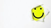 Smile face inside yellow background and white punch paper with copy space for positive mindset and client excellent evaluation c