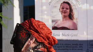 <p>A demonstrator wears a mask in front of an image of Renee Good during a protest to denounce the Trump administration's immigration enforcement polices in Los Angeles. File Picture: Jae C Hong/AP</p>