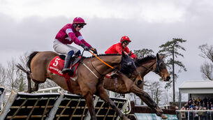 <p>JJ Slevin on board Home By The Lee (red silks) wins ahead of Danny Gilligan on board Staffordshire Knot. Pic ©INPHO/Morgan Treacy</p>