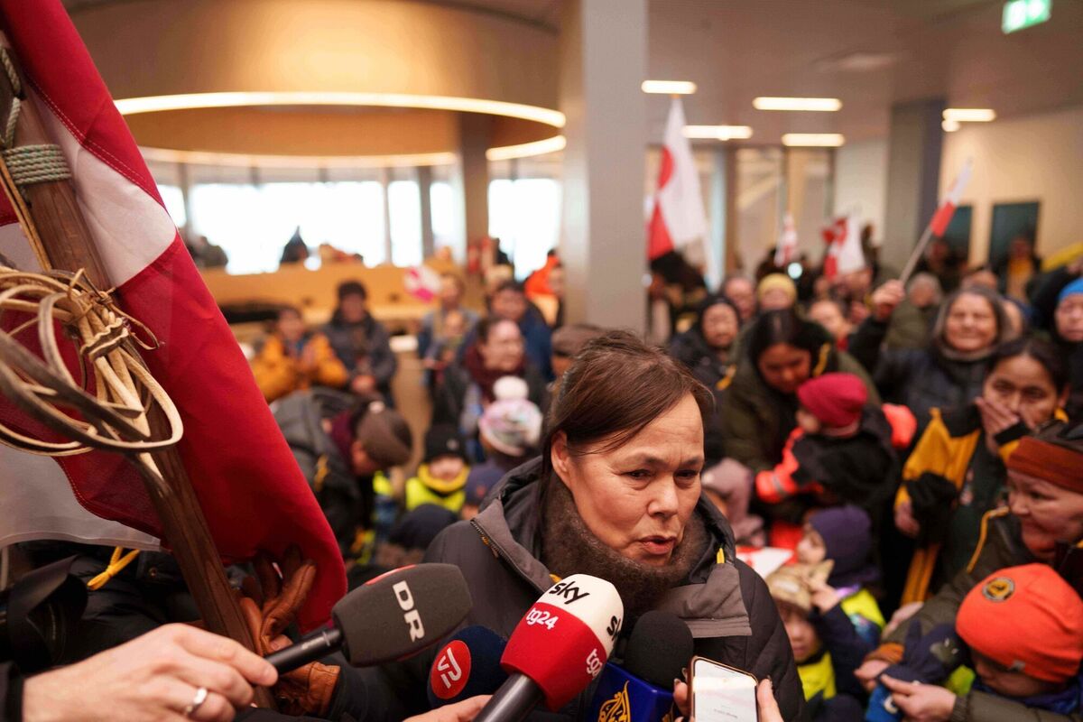 Greenland Minister for Foreign Affairs and Research Vivian Motzfeldt speaks to journalists after arriving at the airport in Nuuk, Greenland, Tuesday, Jan. 20, 2026. (AP Photo/Evgeniy Maloletka)