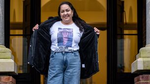 <p>Fernanda Fonseca at the doors of the Anglesea Street Courthouse in Cork wearing a T-shirt bearing a photograph of her sister Bruna Fonseca and the words “You are unforgettable”, a message she also has tattooed on her arm. Picture: Chani Anderson</p>