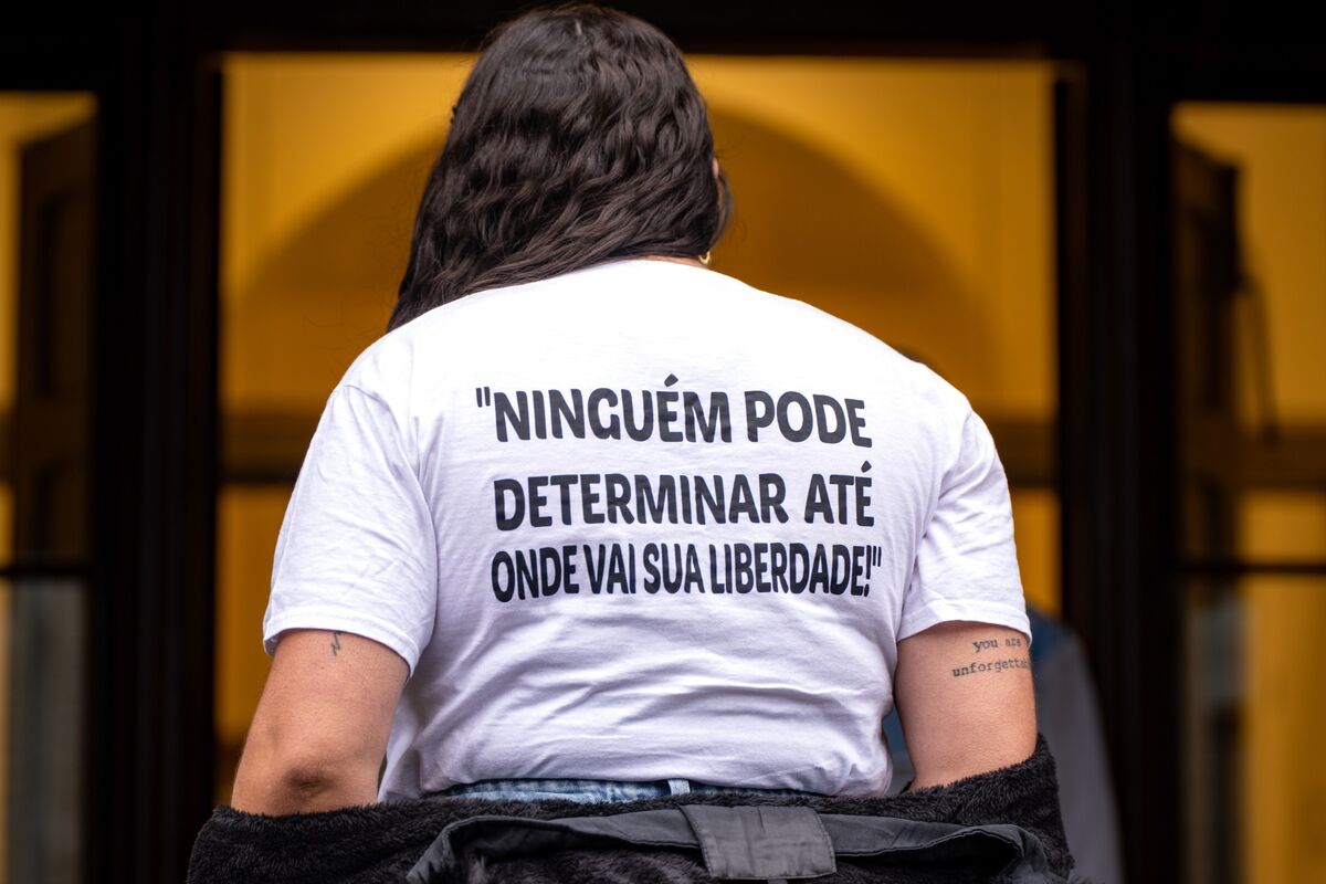 Fernanda, sister of Bruna Fonseca, stands at the doors of the courthouse wearing a T-shirt bearing a message in Portuguese reading: “No one can decide the limits of your freedom”. The same phrase is also tattooed on her arm. Picture: Chani Anderson Fernanda, sister of Bruna Fonseca, stands at the doors of the courthouse wearing a T-shirt bearing a message in Portuguese reading: “No one can decide the limits of your freedom”. The same phrase is also tattooed on her arm. Picture: Chani Anderson