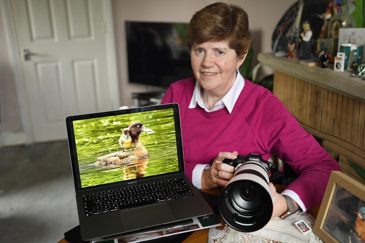  Carol McCabe, with her image of a tufted duck with baby on board that she took at Bushy Park in Dublin — the overall winner in the Irish Examiner Readers Photography Competition 2025. Picture: Moya Nolan