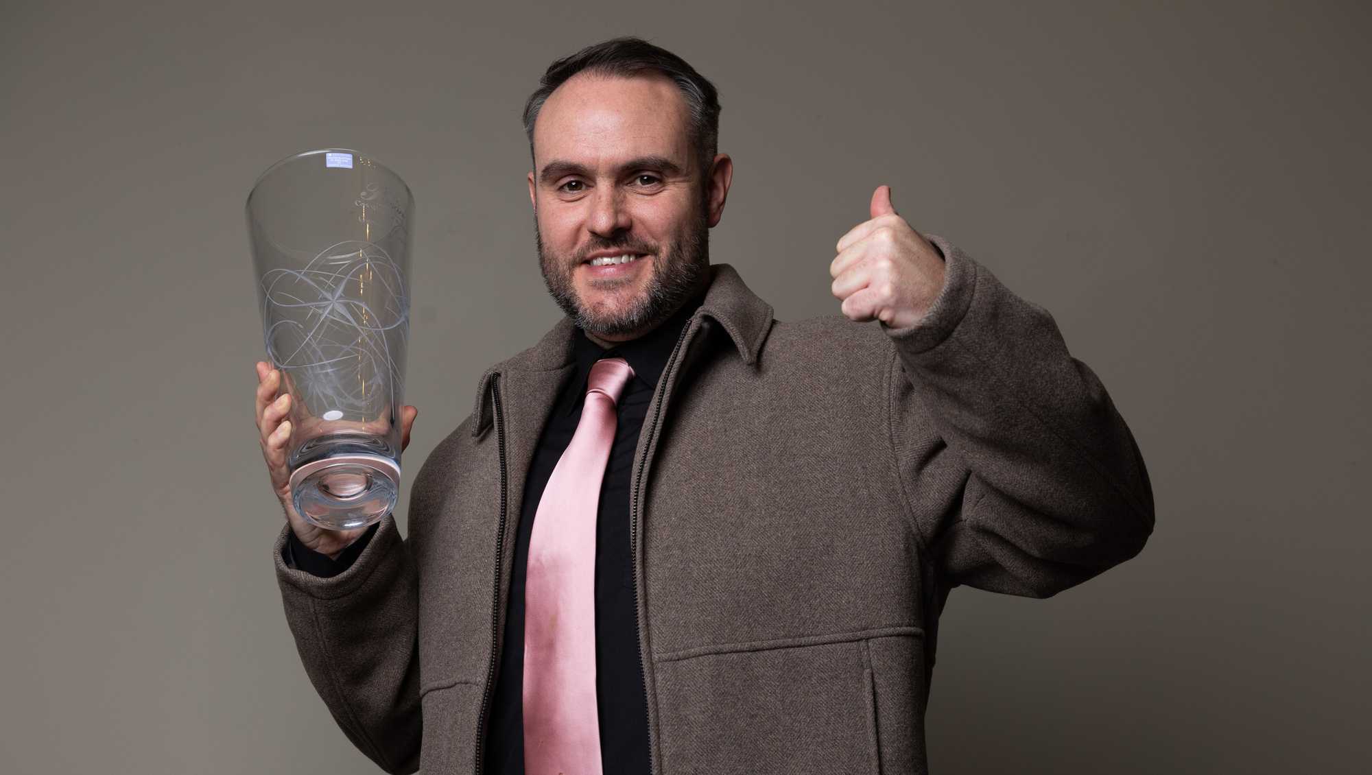 Garry McCarthy with his award after being named Cork Person of the Year 2026 at a ceremony in the Metropole Hotel on Friday. Picture: Darragh Kane