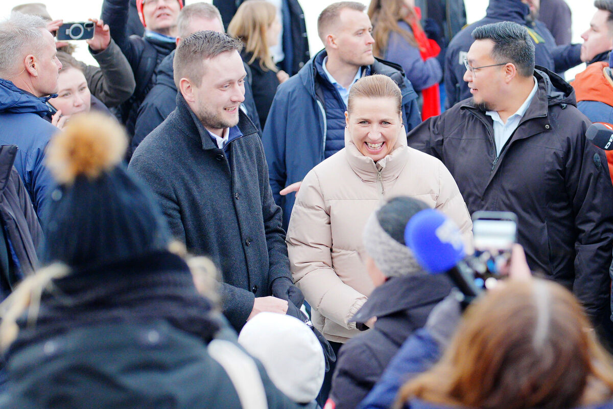 The prime ministers of Greenland and Denmark, Jens-Frederik Nielsen and Mette Frederiksen, greet schoolchildren during a walkabout in Nuuk, Greenland on Friday. Picture: Ben Birchall/PA