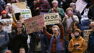 <p>Attendees hold signs during a rally against federal immigration enforcement at Target Center on Friday, Jan. 23, 2026, in Minneapolis. Picture: AP Photo/Angelina Katsanis</p>