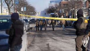<p>Federal agents stand near the site of a shooting Saturday, Jan. 24, 2026, in Minneapolis. Picture: AP Photo/Abbie Parr</p>