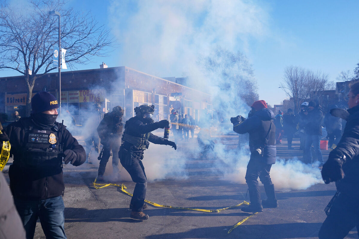 Federal immigration officers deploy tear gas at protesters after a shooting Saturday, Jan. 24, 2026, in Minneapolis. Picture: AP Photo/Abbie Parr