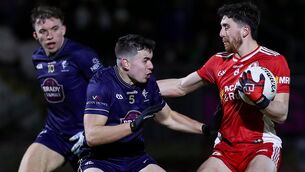 <p>FEARLESS: Tyrone's Joe Oguz with Kildare's James Harris. Pic: ©INPHO/Lorcan Doherty.</p>