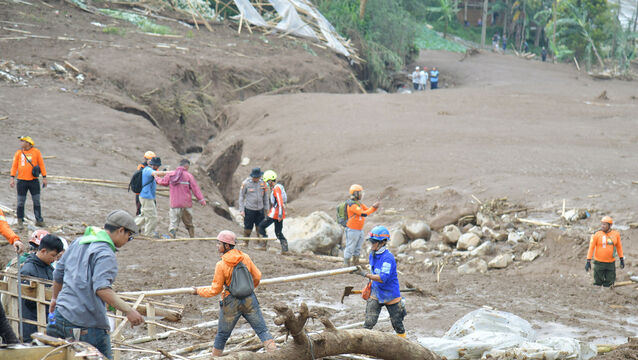 Rrescuers search for victims in Pasir Langu village (BASARNAS via AP)