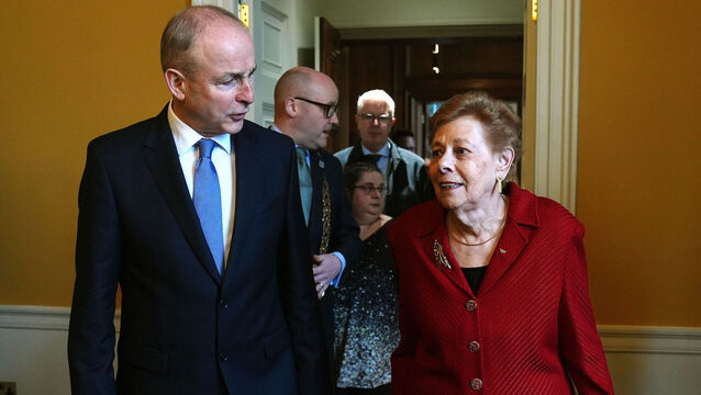 <p>Taoiseach Micheál Martin with Holocaust survivor Suzi Diamond at a Holocaust Memorial Day commemoration at the Royal Hospital Kilmainham in Dublin on Sunday. Picture: Brian Lawless/PA</p>