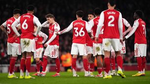 <p>Arsenal's Martin Odegaard (left centre) and team-mates appear dejected after Manchester United score their second goal. Photo: Mike Egerton/PA Wire. </p>