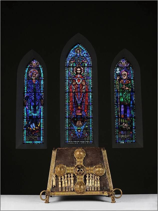 The 12th century St Manchan’s Shrine, believed to hold the relics of the saint, set against stained-glass windows by Harry Clarke in Boher Church, in Lemanaghan, Co Offaly. The shrine is venerated on 24 January each year. Picture: Kevin O’Dwyer 