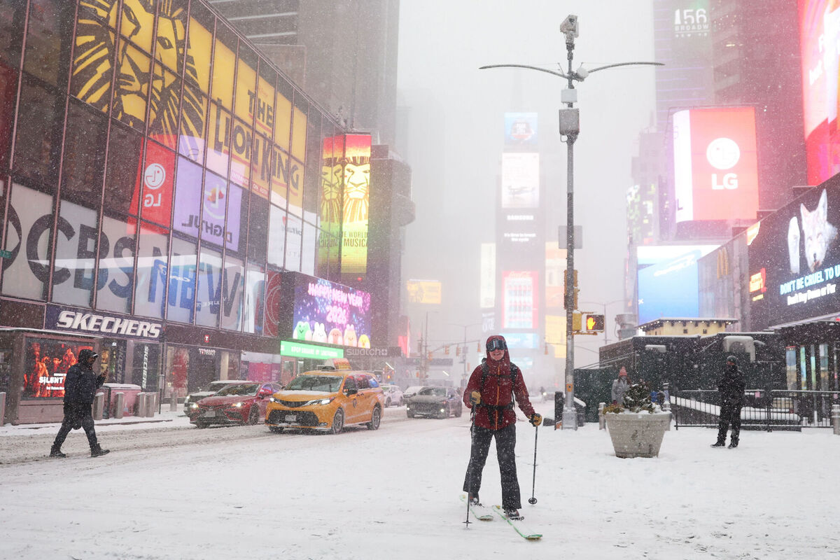A person cross-country skis through Times Square during a winter storm, Sunday, Jan. 25, 2026, in New York. (AP Photo/Heather Khalifa) A person cross-country skis through Times Square during a winter storm, Sunday, Jan. 25, 2026, in New York. (AP Photo/Heather Khalifa)