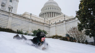 <p>Emilia O'Brien, of Michigan, sleds outside the U.S. Capitol, Sunday, Jan. 25, 2026, in Washington. (AP Photo/Julia Demaree Nikhinson)</p>