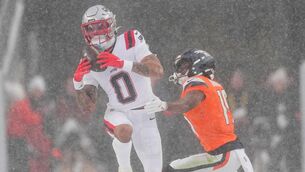 <p>SNOW JOKE: New England Patriots cornerback Christian Gonzalez intercepts a pass. Pic: AP Photo/David Zalubowski.</p>