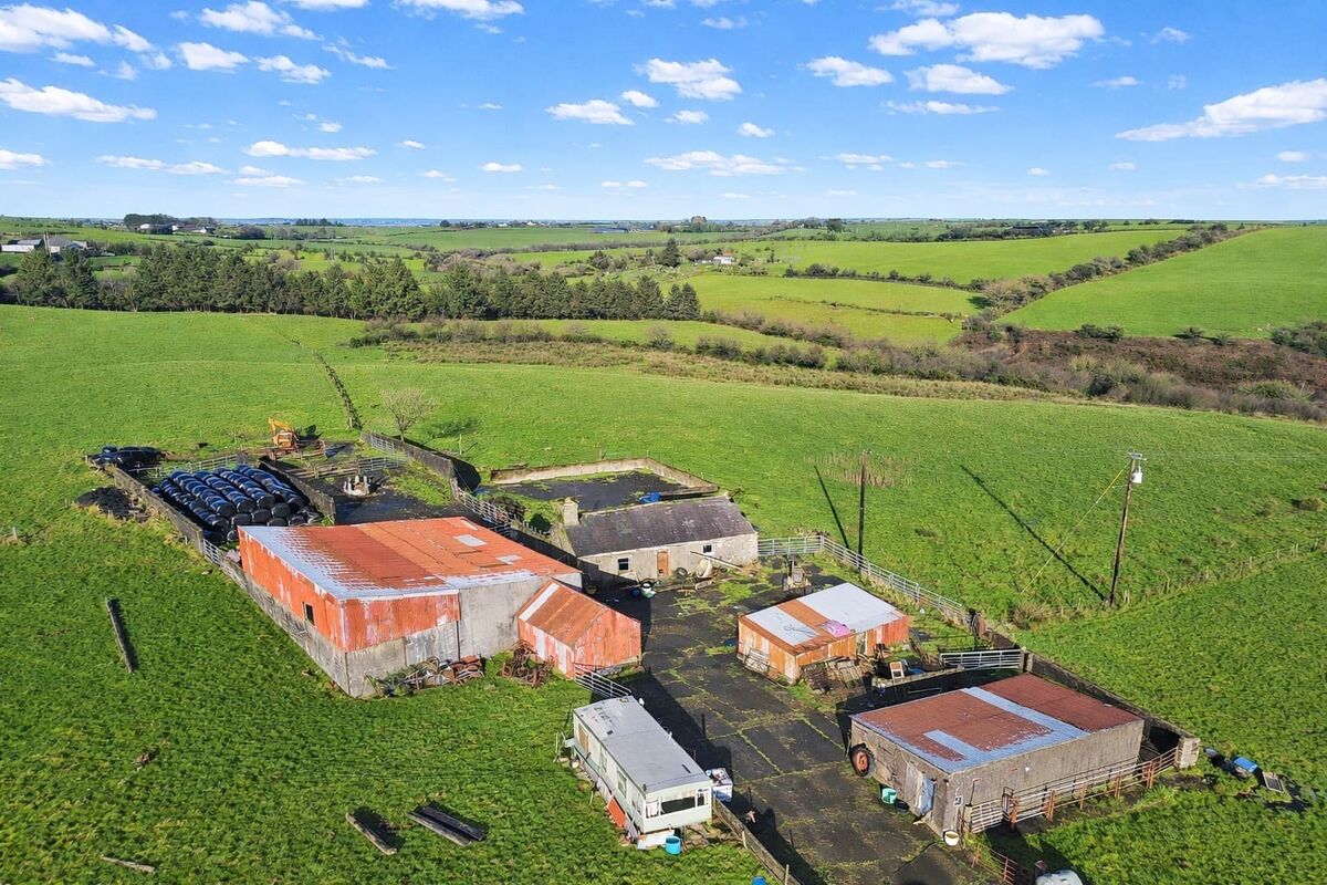 The farmhouse and outbuildings on the 49-acre farm.