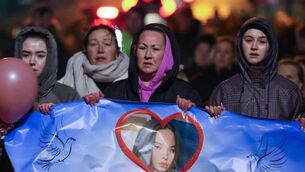 <p>Grace Lynch's mother Siobhán, centre, during a vigil and walk in memory of 16-year-old Grace.</p>