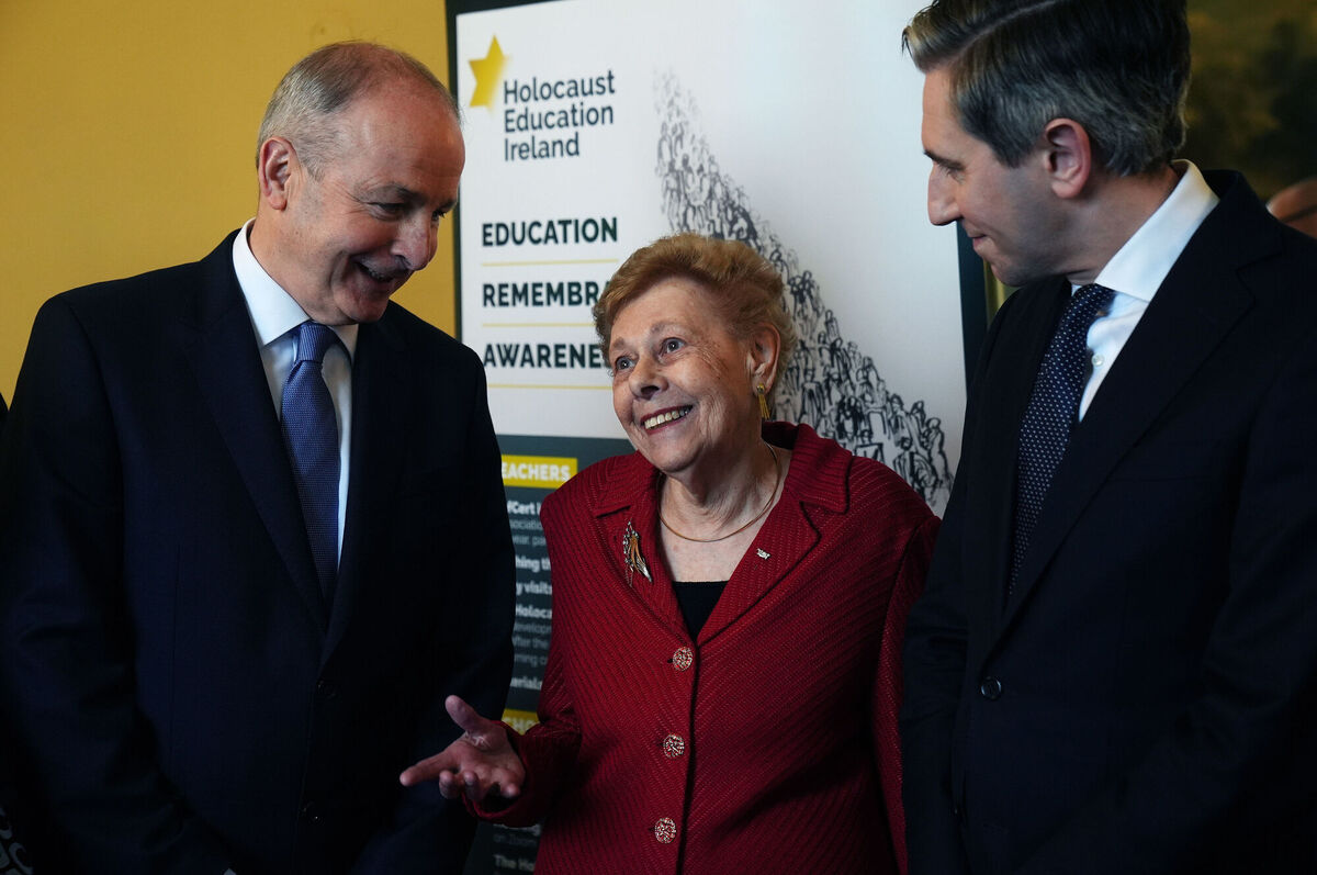Taoiseach Micheal Martin and Tánaiste Simon Harris with Holocaust survivor Suzi Diamond at Ireland's Holocaust Memorial Day commemoration at the Royal Hospital Kilmainham in Dublin on Sunday. Picture: Brian Lawless/PA Taoiseach Micheal Martin and Tánaiste Simon Harris with Holocaust survivor Suzi Diamond at Ireland's Holocaust Memorial Day commemoration at the Royal Hospital Kilmainham in Dublin on Sunday. Picture: Brian Lawless/PA