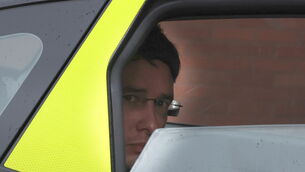 <p>Enoch BUrke arriving at the Four Courts where he was sent back to jail.</p>