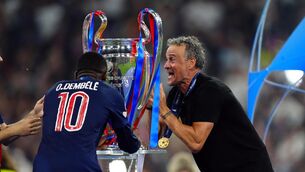 <p>Paris Saint-Germain manager Luis Enrique and Ousmane Dembele with the trophy. Pic: Mike Egerton/PA Wire.</p>