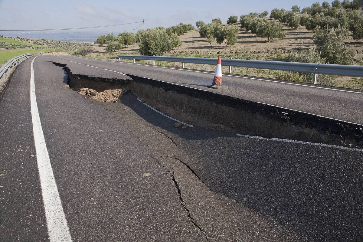 Asphalt road with a crack caused by landslides, in Jaén, Andalusia, Spain in 2014