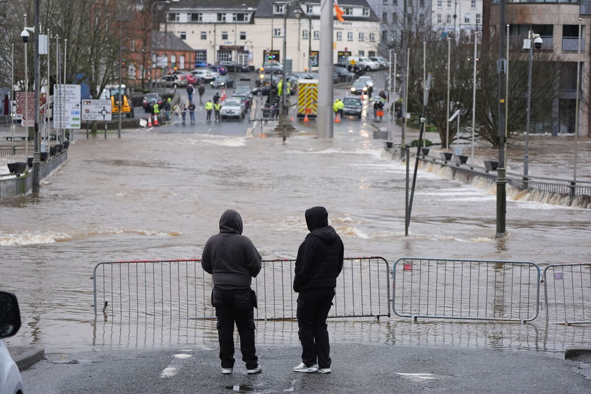 People look at floodwater in Enniscorthy, Co. Wexford. Picture: Niall Carson/PA Wire