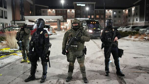 <p>Law enforcement officers stand during a protest outside SpringHill Suites and Residence Inn by Marriott hotels on Monday, Jan. 26, 2026, in Maple Grove, Minn. (AP Photo/Adam Gray)</p> <p>Law enforcement officers stand during a protest outside SpringHill Suites and Residence Inn by Marriott hotels on Monday, Jan. 26, 2026, in Maple Grove, Minn. (AP Photo/Adam Gray)</p>