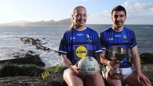 <p>Kerry's Caoimhe Evans and Brian Ó Beaglaoich launching the Lidl Comórtas Peile Páidí Ó Sé 2026 at Dooneen Pier in Feohanagh, West Kerry.</p> <p>Kerry's Caoimhe Evans and Brian Ó Beaglaoich launching the Lidl Comórtas Peile Páidí Ó Sé 2026 at Dooneen Pier in Feohanagh, West Kerry.</p>