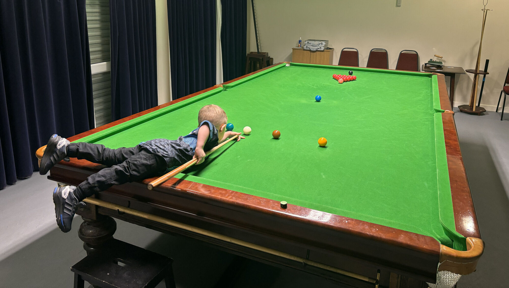Two-year-old snooker prodigy pots two Guinness World Records with trick shots