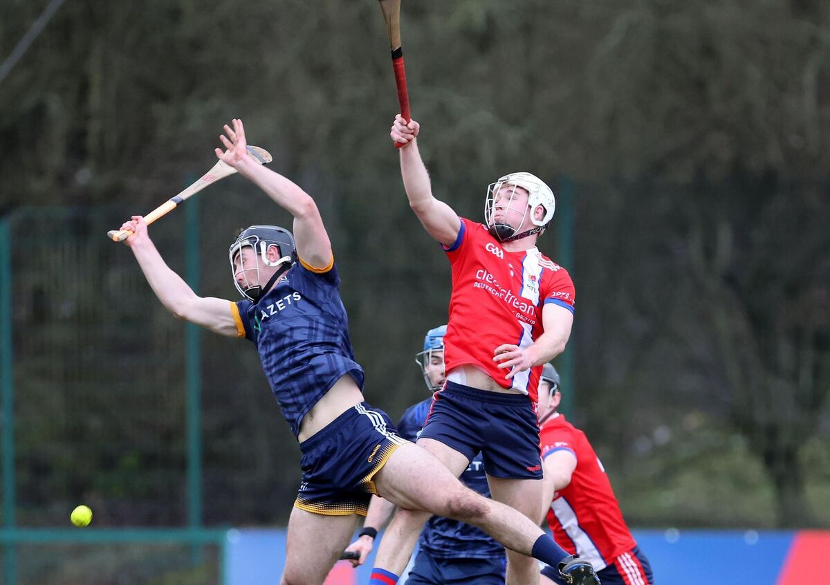  Ruairi O'Connor of MTU and Sean Gallagher of DCU rise to meet the high ball. Picture: Jim Coughlan.