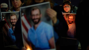 <p>People hold up photos during a vigil for Alex Pretti, who was shot and killed by federal immigration enforcement in Minneapolis Picture: John Locher/AP</p> <p>People hold up photos during a vigil for Alex Pretti, who was shot and killed by federal immigration enforcement in Minneapolis Picture: John Locher/AP</p>