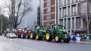 <p>Tractor convoy as part of the IFA protest outside the Bord Bia Dublin offices. Photo: Finbarr O'Rourke</p>