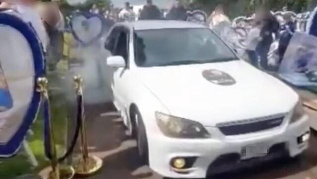 <p>Footage has emerged of someone revving a Toyota Altezza's engine and spinning its rear wheels repeatedly to burn rubber in the internal roads of Kilcully Cemetery on the city’s northside during a funeral, as mourners look on from just few feet away.</p>