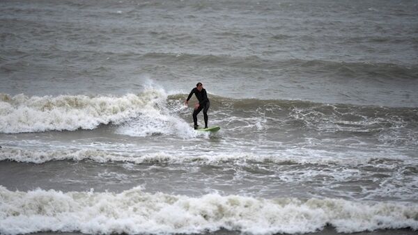 A surfer hitting the beach at Fountainstown in Cork. Picture: Larry Cummins A surfer hitting the beach at Fountainstown in Cork. Picture: Larry Cummins