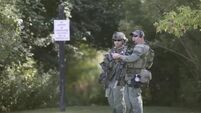 Massive manhunt underway for three suspects after Illinois officer shot dead