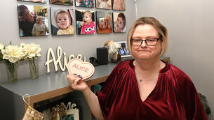 <p>Majella Spang beside a spread of photos of Alice. 'She had the doctors baffled so many times because she fought so hard to live.' Picture: Larry Cummins</p>