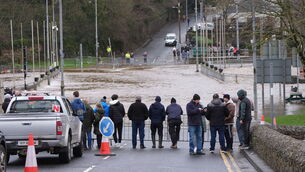 <p>People watching the banks of the River Slaney flood in Enniscorthy, Co. Wexford. Picture: Niall Carson/PA Wire</p>