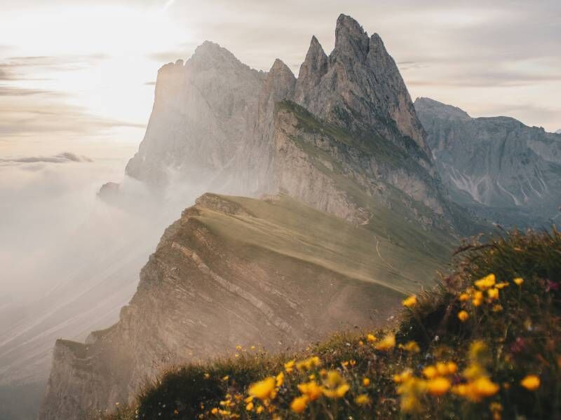 The Dolomites in summer - cool air, still paths, alpine calm. 