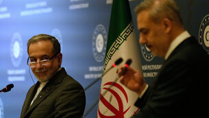 <p>Iranian Foreign Minister Abbas Araghchi, left, looks at his Turkish counterpart Hakan Fidan during a joint press conference in Istanbul Picture: Khalil Hamra/AP</p>